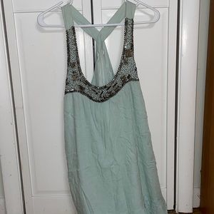 Beaded en creme flows top.